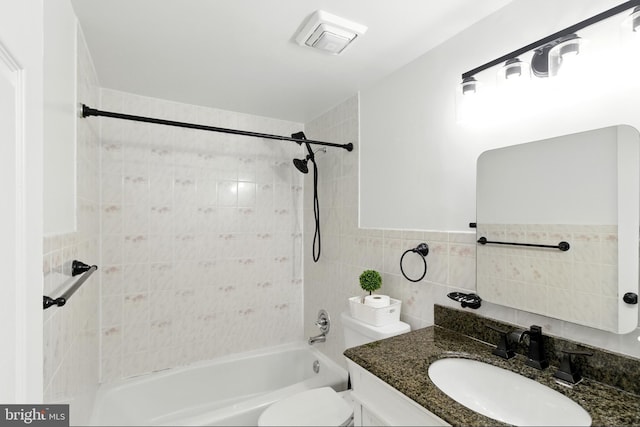 13727 Mahoney Dr, Woodbridge, VA 22193 - full bath featuring vanity,  shower combination, and tile walls