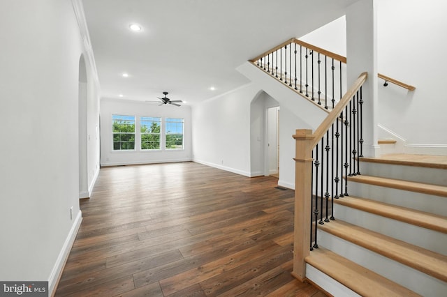 9936 Bell Wood Farm Ln, Nokesville, VA 20181 - unfurnished living room featuring arched walkways, wood-type flooring, ceiling fan, stairway, and recessed lighting
