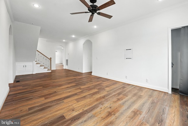 9936 Bell Wood Farm Ln, Nokesville, VA 20181 - unfurnished living room with arched walkways, a ceiling fan, ornamental molding, hardwood / wood-style flooring, and stairway