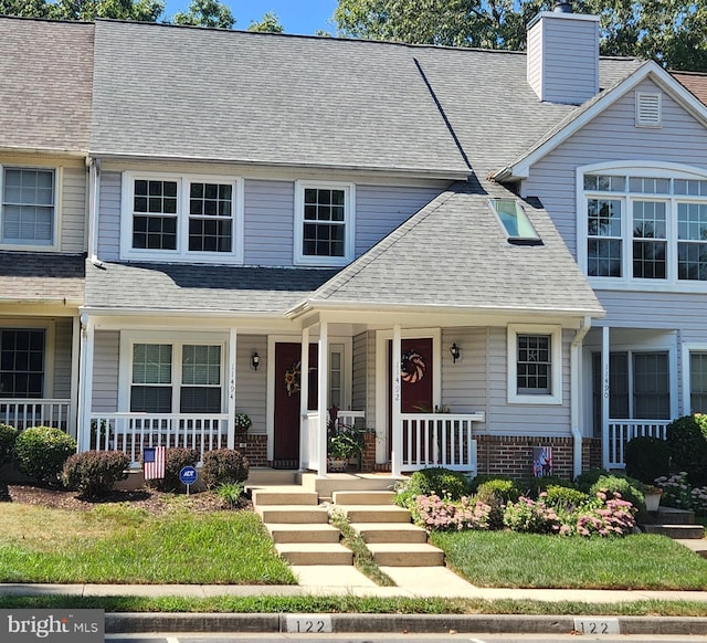 11492 Corinthia Ct, Woodbridge, VA 22192 - townhome / multi-family property featuring a porch, brick siding, and a shingled roof