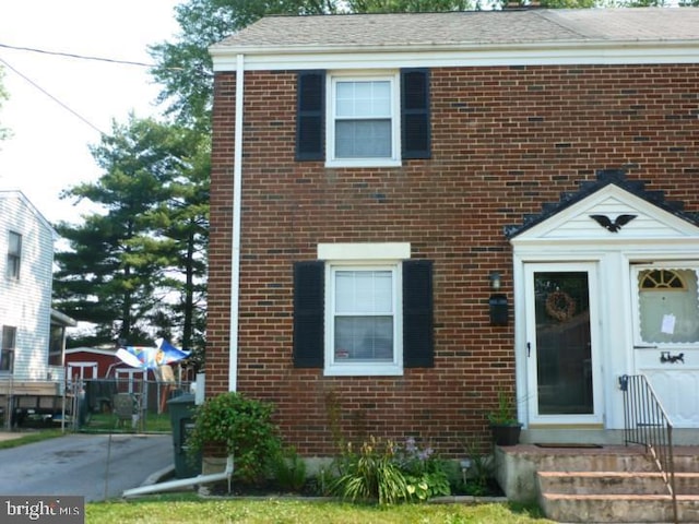 1400 Windsor Ave, Wilmington, DE 19804 - view of front facade featuring brick siding, entry steps, and a shingled roof