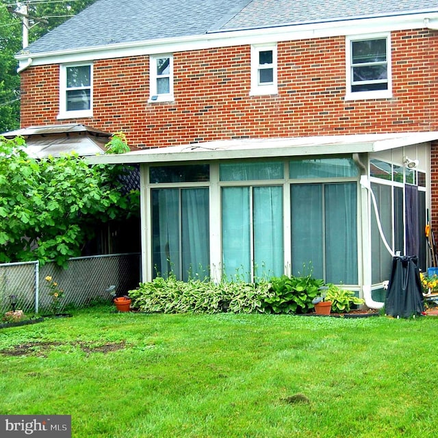 1400 Windsor Ave, Wilmington, DE 19804 - rear view of house with a sunroom, roof with shingles, and brick siding