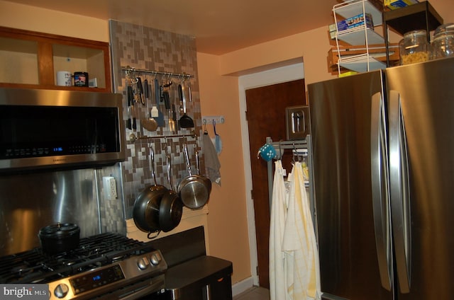 1400 Windsor Ave, Wilmington, DE 19804 - kitchen with stainless steel appliances, backsplash, and tile patterned flooring