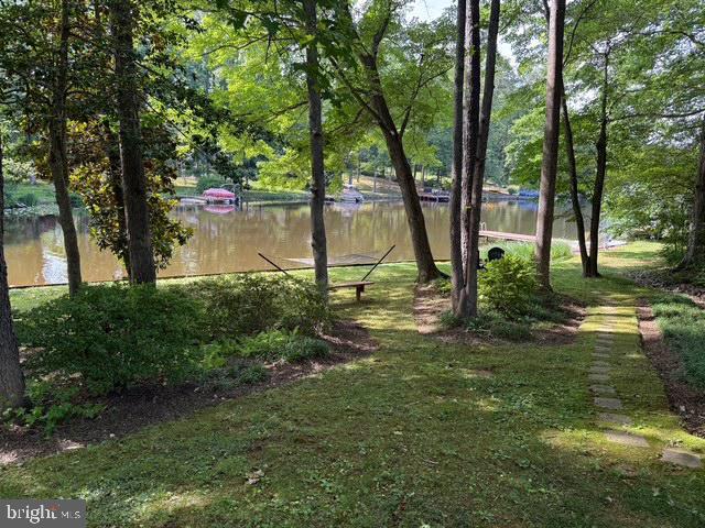 210 Lake Caroline Dr, Ruther Glen, VA 22546 - view of yard with a water view