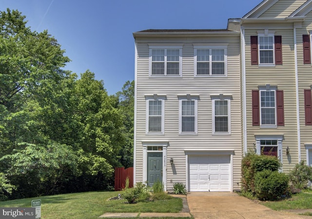 43855 Tattinger Ter, Ashburn, VA 20148 - view of front facade featuring a garage, driveway, and a front lawn