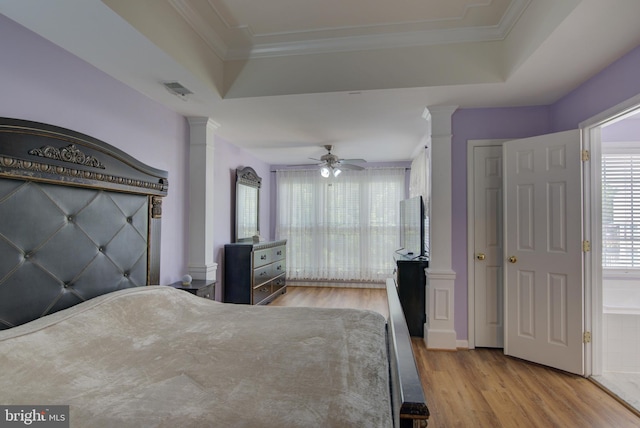 43855 Tattinger Ter, Ashburn, VA 20148 - bedroom with ornate columns, wood finished floors, a tray ceiling, ornamental molding, and ceiling fan