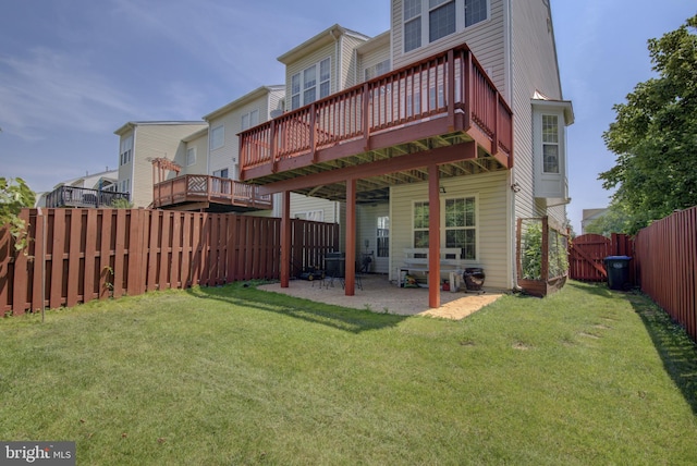 43855 Tattinger Ter, Ashburn, VA 20148 - back of property featuring a fenced backyard, a patio, and a deck
