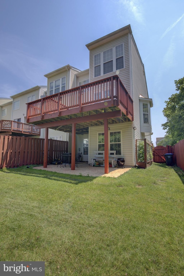 43855 Tattinger Ter, Ashburn, VA 20148 - back of property featuring a fenced backyard, a patio area, and a deck
