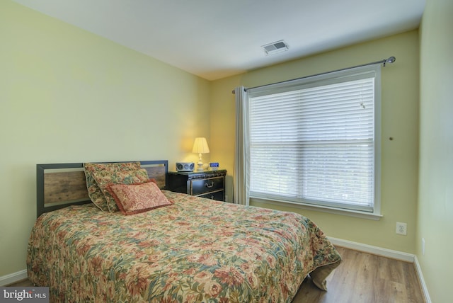 43855 Tattinger Ter, Ashburn, VA 20148 - bedroom featuring baseboards and wood finished floors
