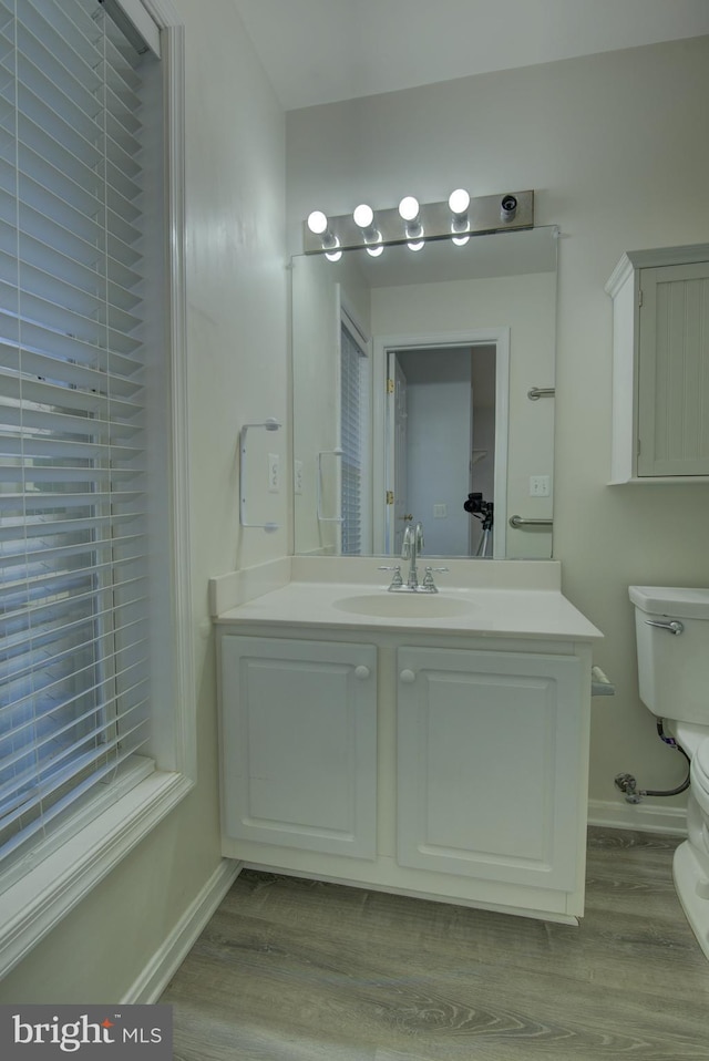 43855 Tattinger Ter, Ashburn, VA 20148 - bathroom with wood finished floors and vanity