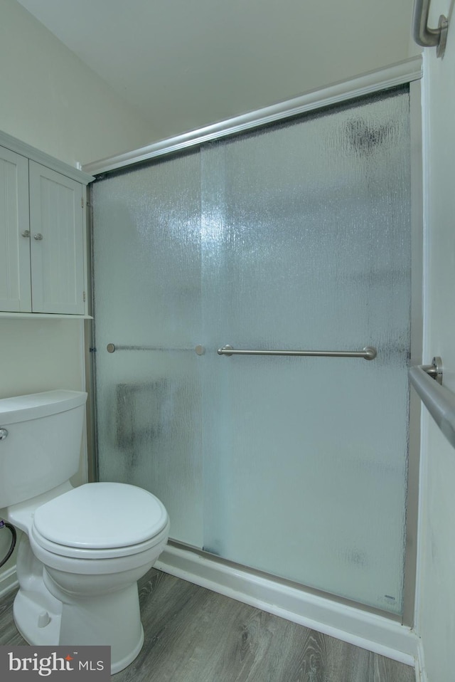 43855 Tattinger Ter, Ashburn, VA 20148 - full bathroom with wood finished floors and a shower with shower door