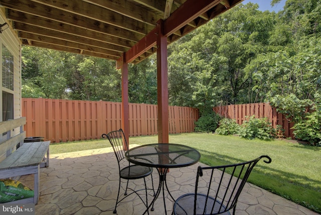 43855 Tattinger Ter, Ashburn, VA 20148 - fenced backyard featuring a patio, outdoor dining area, and a view of trees