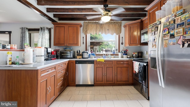 315 Leedom Ave, Bristol, PA 19007 - kitchen featuring appliances with stainless steel finishes, beamed ceiling, light countertops, brown cabinets, and light tile patterned flooring