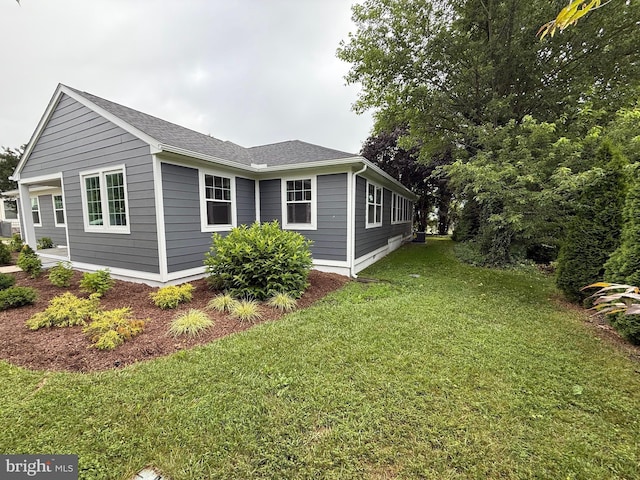 11 Cornwall Rd, Rehoboth Beach, DE 19971 - view of property exterior with a lawn and roof with shingles