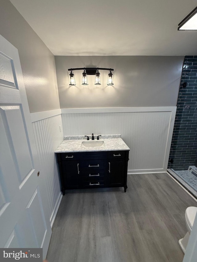 11 Cornwall Rd, Rehoboth Beach, DE 19971 - full bath with wainscoting, wood finished floors, a shower stall, and vanity