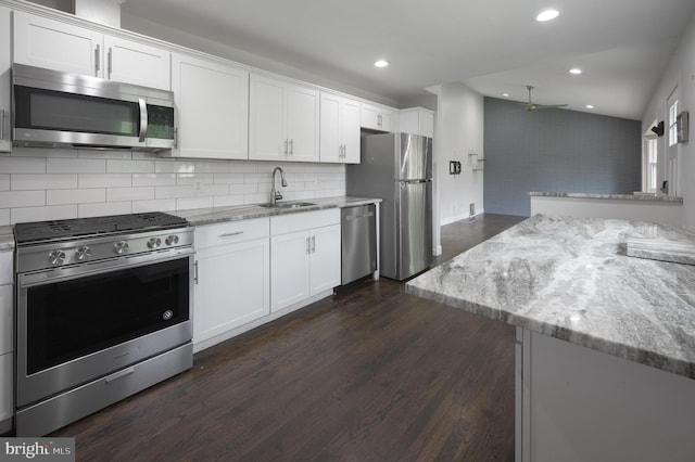 26 Hemlock Dr, Parlin, NJ 08859 - kitchen featuring stainless steel appliances, light stone counters, dark wood finished floors, white cabinets, and recessed lighting