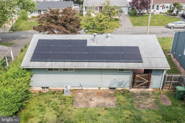26 Hemlock Dr, Parlin, NJ 08859 - rear view of property featuring solar panels and a shingled roof