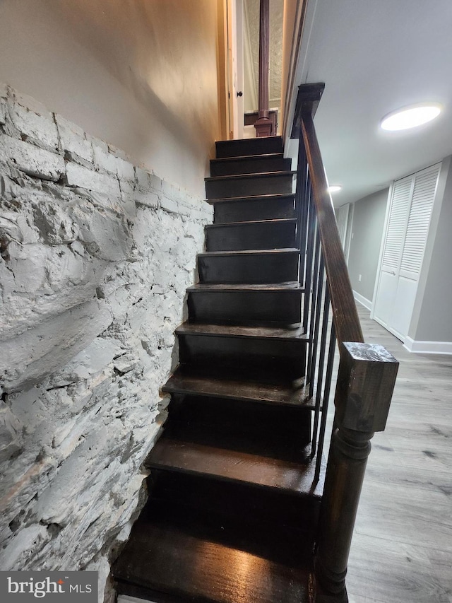 708 N Madeira St, Baltimore, MD 21205 - staircase featuring wood finished floors and baseboards