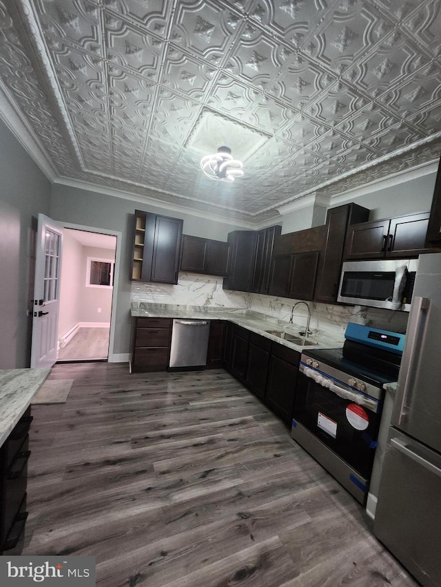 708 N Madeira St, Baltimore, MD 21205 - kitchen featuring stainless steel appliances, an ornate ceiling, decorative backsplash, dark wood finished floors, and open shelves