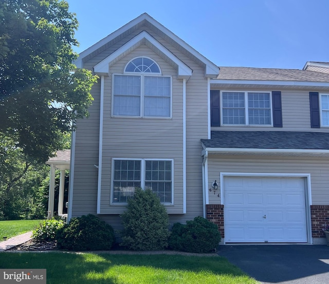 674 Honeysuckle Way, Pennsburg, PA 18073 - view of front of home featuring a garage and brick siding