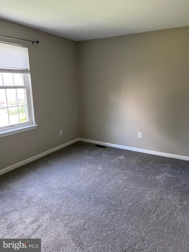 674 Honeysuckle Way, Pennsburg, PA 18073 - unfurnished room featuring dark carpet and baseboards