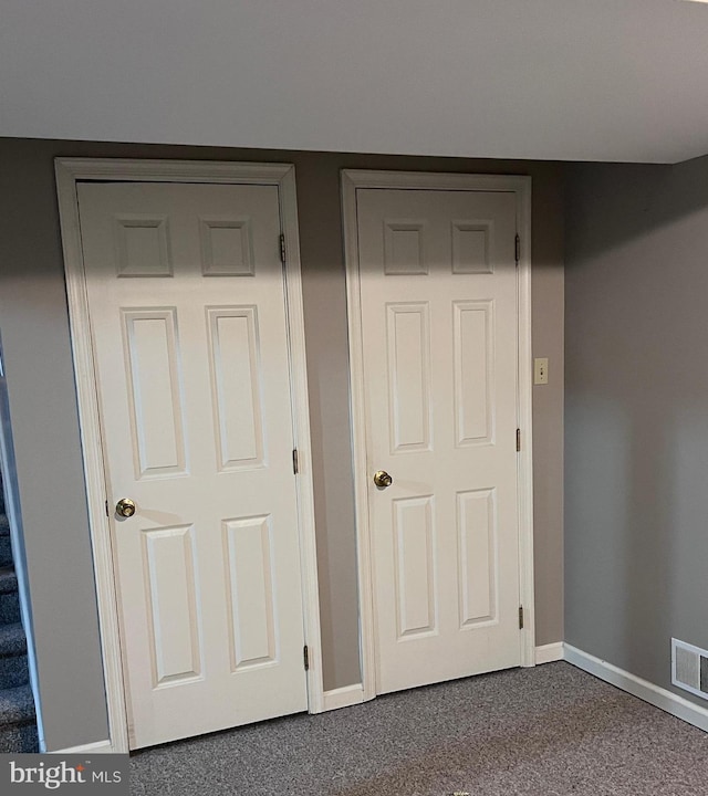 674 Honeysuckle Way, Pennsburg, PA 18073 - unfurnished bedroom featuring dark colored carpet and baseboards