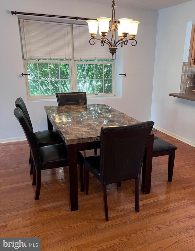 674 Honeysuckle Way, Pennsburg, PA 18073 - dining area featuring a chandelier and wood finished floors