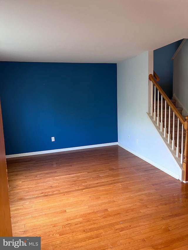 674 Honeysuckle Way, Pennsburg, PA 18073 - unfurnished room with wood finished floors and stairway