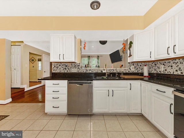 18040 Singing Pine Cir, Montgomery Village, MD 20886 - kitchen with stainless steel dishwasher, light tile patterned flooring, white cabinetry, tasteful backsplash, and ornamental molding