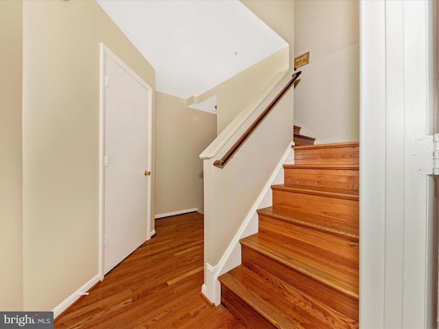 18040 Singing Pine Cir, Montgomery Village, MD 20886 - stairs featuring wood finished floors and baseboards