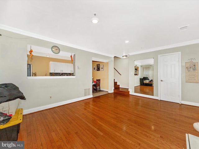 18040 Singing Pine Cir, Montgomery Village, MD 20886 - unfurnished living room featuring wood finished floors, stairs, crown molding, and recessed lighting