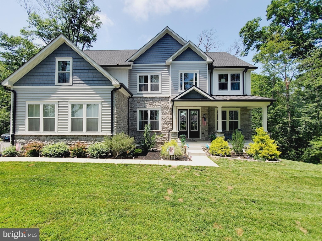 520 Walters Mill Rd, Forest Hill, MD 21050 - craftsman inspired home featuring stone siding, a front lawn, and a porch