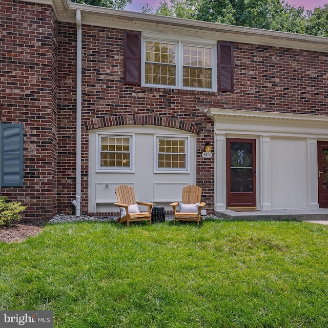 5917 Kingsford Rd Unit 366, Springfield, VA 22152 - doorway to property with brick siding and a yard