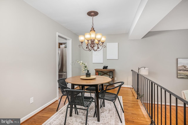 5917 Kingsford Rd Unit 366, Springfield, VA 22152 - dining room featuring a chandelier and light wood-style flooring