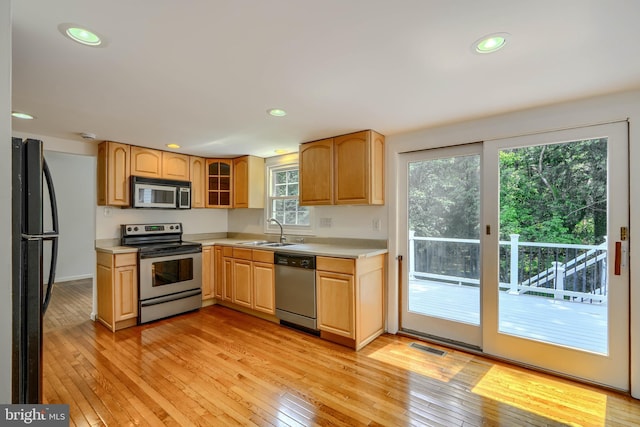 1720 Denton Ct, Crofton, MD 21114 - kitchen with stainless steel appliances, light countertops, light wood-style floors, recessed lighting, and light brown cabinets