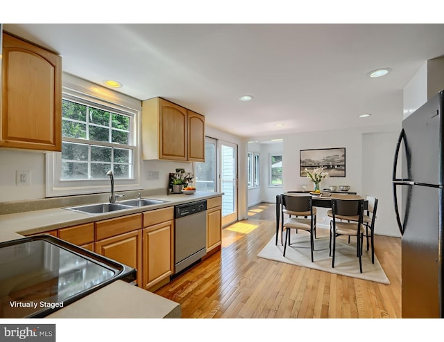 1720 Denton Ct, Crofton, MD 21114 - kitchen featuring dishwasher, freestanding refrigerator, light wood finished floors, light countertops, and range