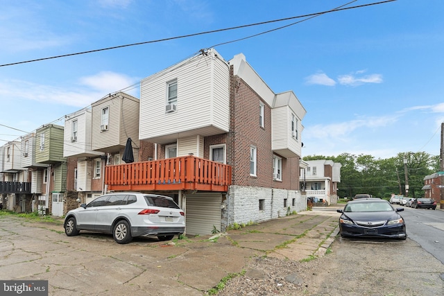 4029 Creston St, Philadelphia, PA 19135 - view of front of house with brick siding, cooling unit, and a residential view