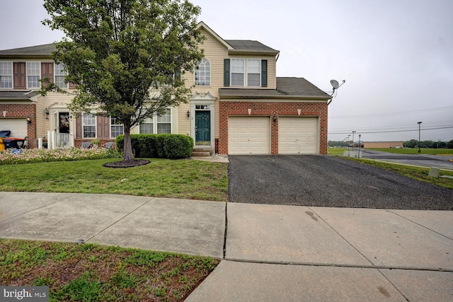 2 N Cummings Dr, Middletown, DE 19709 - view of front facade featuring driveway, brick siding, and a front lawn