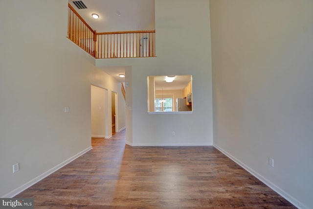 2 N Cummings Dr, Middletown, DE 19709 - unfurnished living room with wood finished floors and a towering ceiling