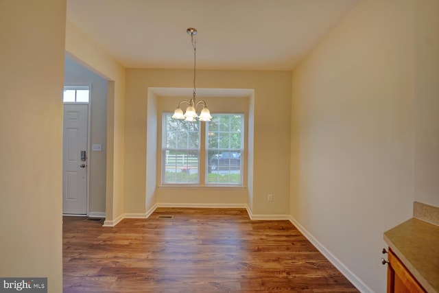 2 N Cummings Dr, Middletown, DE 19709 - unfurnished dining area featuring plenty of natural light, dark wood-style floors, and a chandelier