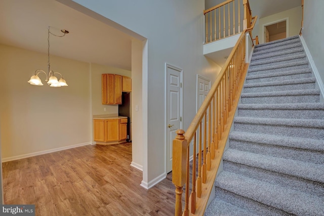 2 N Cummings Dr, Middletown, DE 19709 - stairs featuring wood finished floors and a chandelier