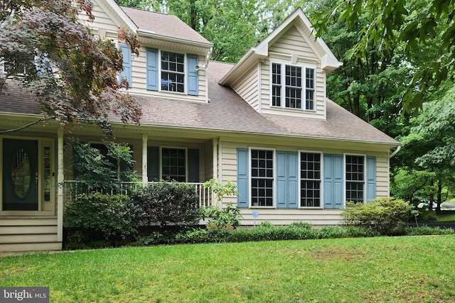 3689 N Carolina Ave, Edgewater, MD 21037 - view of front facade featuring a front lawn, a porch, and a shingled roof
