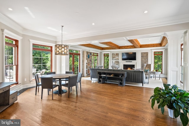 3801 52nd St NW, Washington, DC 20016 - dining space with a lit fireplace, wood finished floors, ornamental molding, coffered ceiling, and recessed lighting