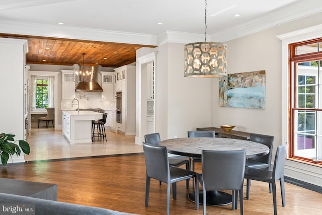 3801 52nd St NW, Washington, DC 20016 - dining area featuring a chandelier, light wood-style floors, ornamental molding, recessed lighting, and wood ceiling