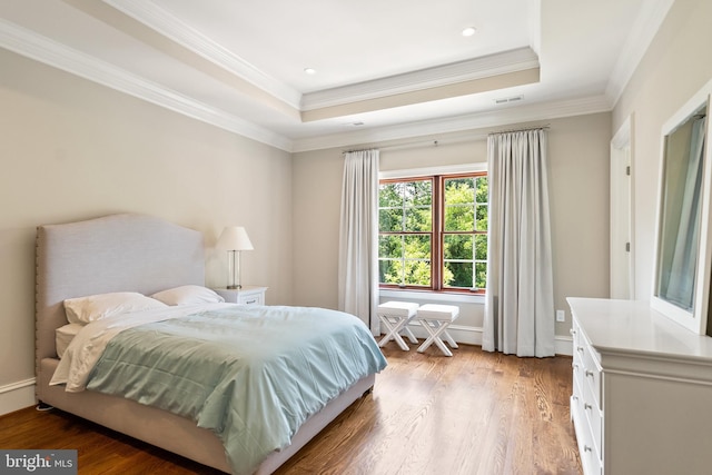 3801 52nd St NW, Washington, DC 20016 - bedroom featuring ornamental molding, a tray ceiling, light wood finished floors, and recessed lighting