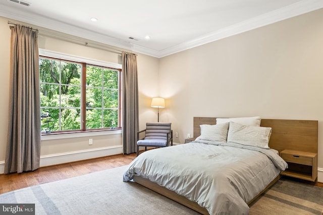 3801 52nd St NW, Washington, DC 20016 - bedroom with wood finished floors, crown molding, and recessed lighting