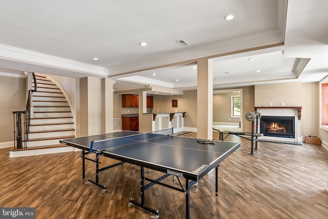 3801 52nd St NW, Washington, DC 20016 - rec room featuring crown molding, wood finished floors, wet bar, recessed lighting, and a lit fireplace
