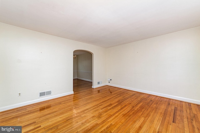 833 Evesham Ave, Baltimore, MD 21212 - spare room featuring arched walkways and light wood-style flooring