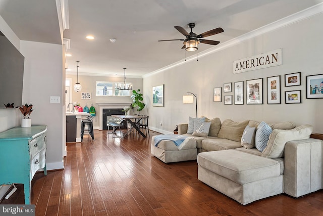 103 Norma Aly, Annapolis, MD 21403 - living room with ceiling fan, dark wood-style floors, a fireplace, ornamental molding, and a chandelier