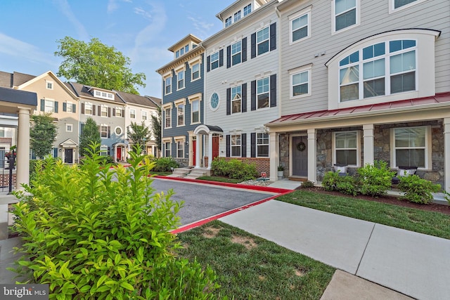 103 Norma Aly, Annapolis, MD 21403 - townhome / multi-family property with stone siding, a standing seam roof, and a residential view